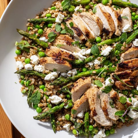 Tossing Warm Spring Farro Chicken Salad with lemon vinaigrette makes a bright, refreshing dinner perfect for springtime evenings.