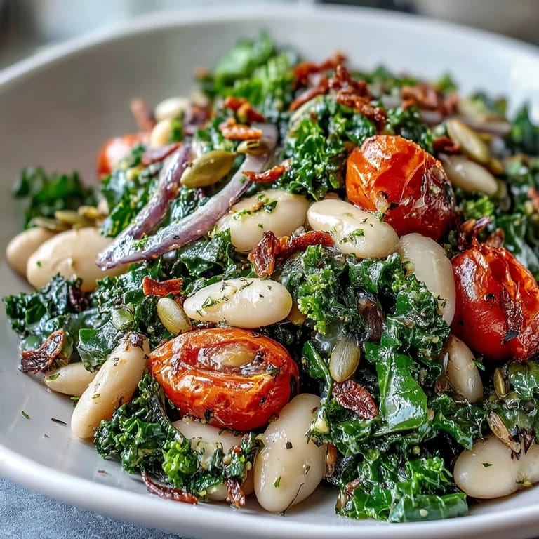 Hearty White Bean and Kale Salad with kale, white beans, red onion, and toasted sunflower seeds, tossed in a lemon-garlic vinaigrette.
